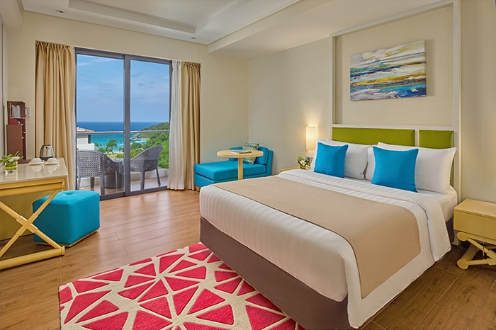 Vibrant comfort and scenic island views come together in the Premier Room at Savoy Hotel Boracay.