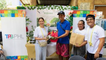 Domestic Promotions Department, Industry Relations and Services Division Chief Ms. Margarita P. San Jose hands over drybag and dryfit shirts to members of Dewil Mangrove Cooperative on behalf of the TPB