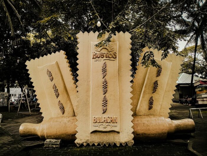 A stone-carved monument celebrating Bustos' iconic Minsan delicacy and its cherished place in the town's culinary heritage.