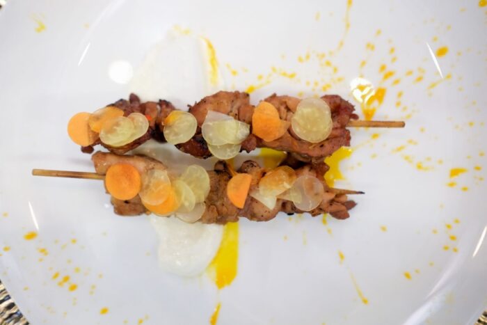Embers of Home: Chicken InasalGrilled chicken thigh served with anato, atchara, and chicken-oil chili. 
