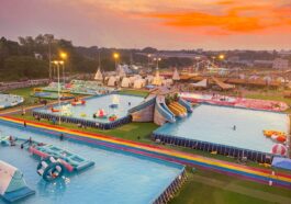 Colorful pools, playful inflatables, and exciting slides stretch across the park, offering visitors plenty of ways to cool off, have fun, and enjoy the vibrant atmosphere as the sun begins to set.