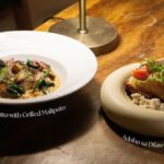 Sinigang Risotto with Grilled Maliputo and Adobo sa Dilaw Chicken Confit, the two featured dishes of PAMANA: Taal, Reimagined.