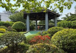 “The gazebo in the maze area, tucked behind sculpted shrubs and bright flowers, offers a place to rest and enjoy the view.”