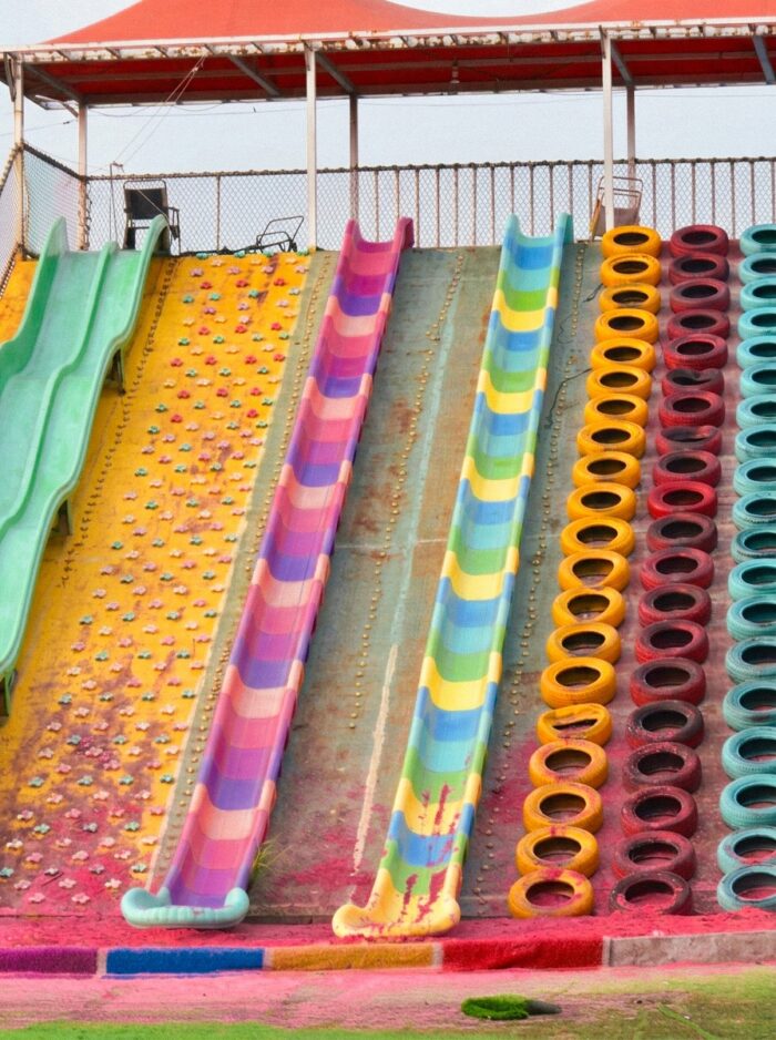The colorful slides invite visitors to race down the slopes and make the most of an exciting day filled with splashes, laughter, and adventure.