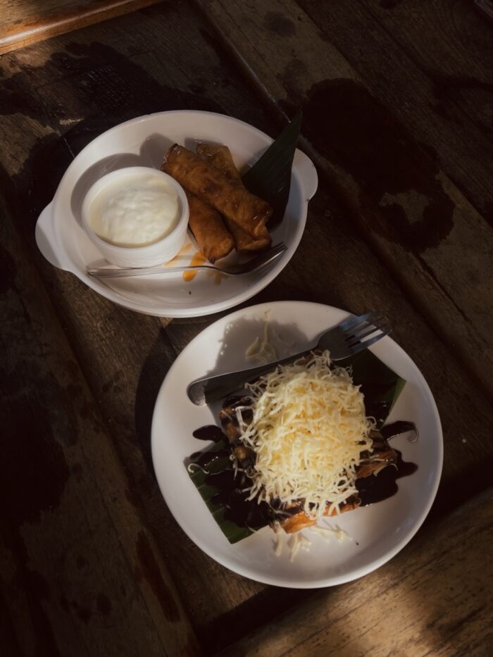 “Saging. Ube. Ligaya.”— A serving of local cuisine featuring TURON with ICE CREAM and a UBE TURON topped with grated cheese and chocolate syrup, showcasing the food offerings available to visitors. 